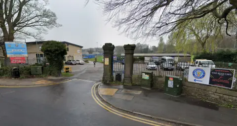 A view from the road into the car park of Lancaster City's Giant Axe ground