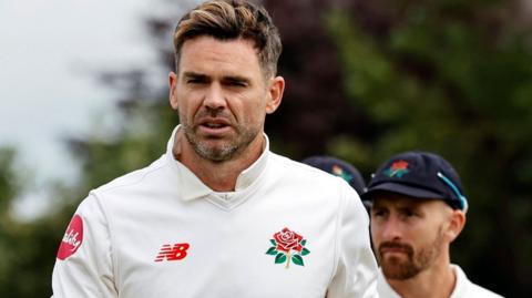 Lancashire bowler James Anderson leaves the pitch at Southport