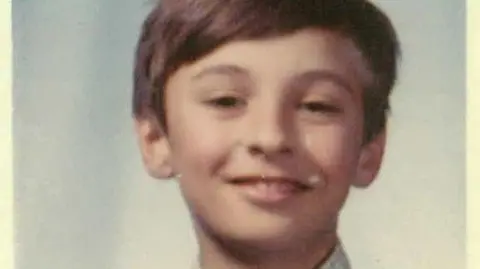 Alex McBratney A picture of the young Alex McBratney with his hair swept to the side and a smile on his face