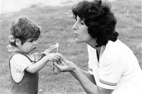 Anthony Nolan Shirley Nolan with her son Anthony. She is playing with her son blowing bubbles 