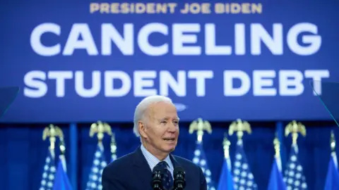 Getty Images US President Joe Biden speaks during an April event in Wisconsin on cancelling student debt