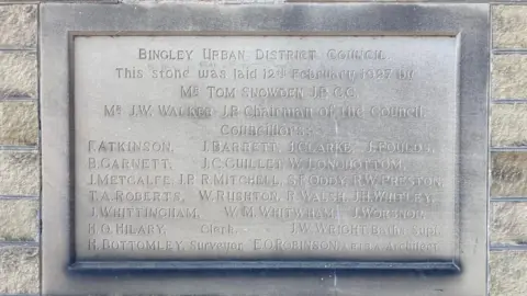 Charles Heslett/BBC Close up of a foundation stone laid on 12 February 1927 by members of Bingley Urban District Council