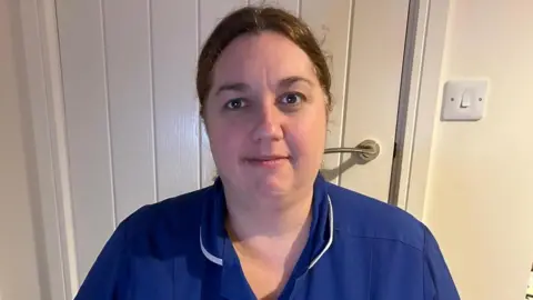 Supplied Zoe Rayner stood in her uniform looking at the camera.