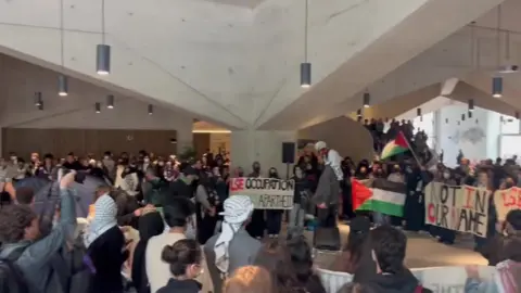 Protestors inside the Marshall Building