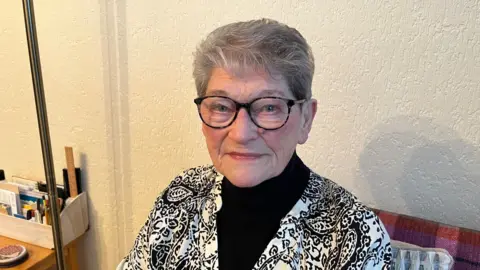 BBC 85-year-old fraud victim Joan staring straight into the camera