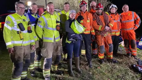 Essex County Fire & Rescue Service Fightfighters with a dog in Great Chesterfield, Essex