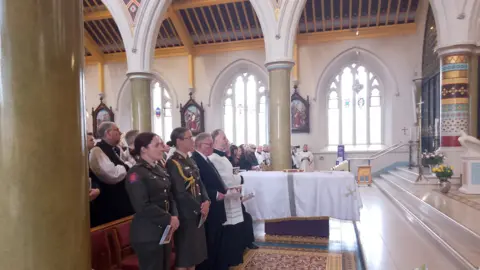 Mourners at St. Peter's Cathedral in Belfast at the funeral of Archbishop Noel Treanor on August 20, 2024