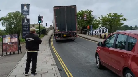 Lorry being driven over Potter Heigham Bridge