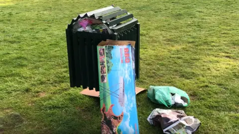 Darren Rozier/BBC Rubbish left near a bin at Needham Lakes