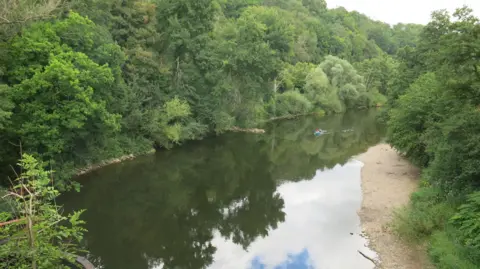 The view of the River Wye looking upstream from Black Bridge in Lydbrook