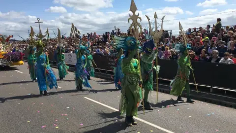 BBC Dancers in front of float at battle of flowers in Jersey