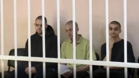 Defence Ministry TV Brahim Saudan and the two British men also sentenced to death