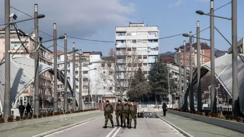 Getty Images Nato-led peacekeepers on the main bridge in Mitrovica in Feburary 2018