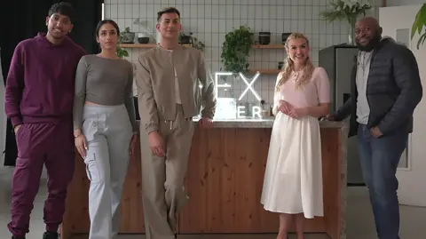 Five people standing in front of an illuminated sign for the Sex After documentary series.