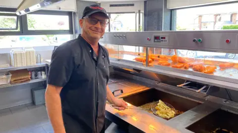 Andreas Symeou frying chips at Shelton Lock Fish Bar