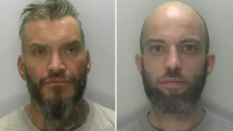 Two custody images of Rowbotham and Rice. Rowbotham has short greasy hair, swept back from his face, a dark grey beard and a large dark tattoo on his neck. Rice is bald, with a short greying beard. Both wear grey t-shirts. 