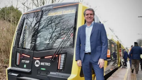 LCRCA Steve Rotheram and a train