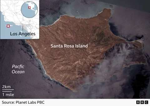 A satellite image showing smoke rising from a fire south on Santa Rosa Island off the coast of California