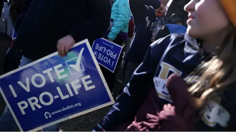 Getty Images 'I vote pro life' sign at activist rally in January in Washington