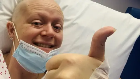 Breast cancer survivor feels complete after nipple tattoo
