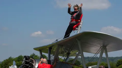 Victoria Bryan Esther Hussey on top of the plane before take off