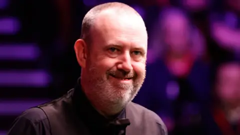 Mark Williams smiles to the crowd