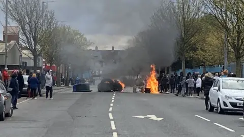 The scene of a loyalist protest at Lanark Way in west Belfast