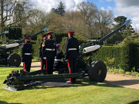 Military personnel wore black face coverings for the gun salute at Hillsborough Castle in County Down.