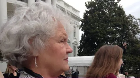 Lynn Neviaser standing on the lawn