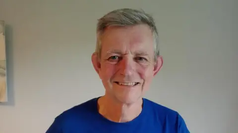 Steve Newman Steve Newman wearing a Refugee Week T-shirt