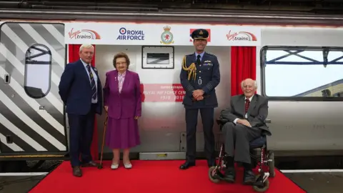 Virgin Trains Paul Williams (Driver Team Manager, Virgin Trains), Mary Roberts., RAF Valley Station Commander Group Captain Nick Tucker-Lowe DSO, with John Wynne