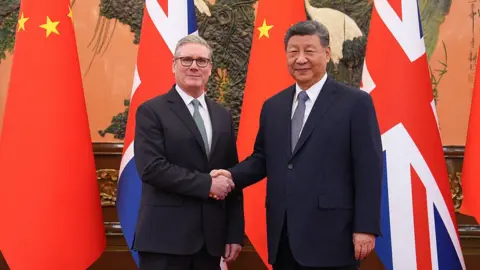 Getty Images Sir Keir Starmer and Xi Jinping shake hands