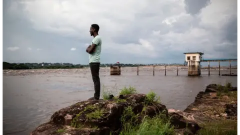 Getty Images Man staring out at river Congo