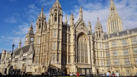 Getty Images A view of St Margaret's Church and Big ben against a cloudy sky