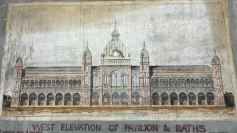 Great Yarmouth Borough Council Architects plans state: West Elevation of Pavilion and Baths, and the image shows a square domed central tower, with lantern, flanked by two smaller towers and a colonnaded facade, which features two more towers on the corners.