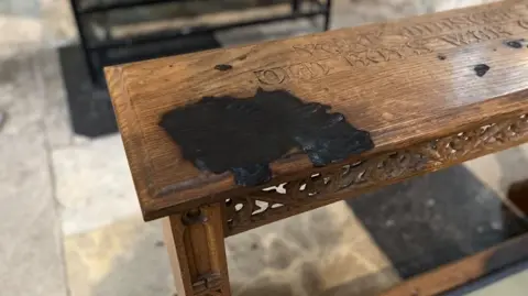 Louise Fewster/BBC Scorched prayer kneeler