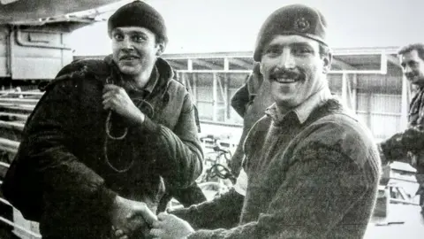 Giorgio Podesta (left) leaving the SS Canberra at Puerto Madryn