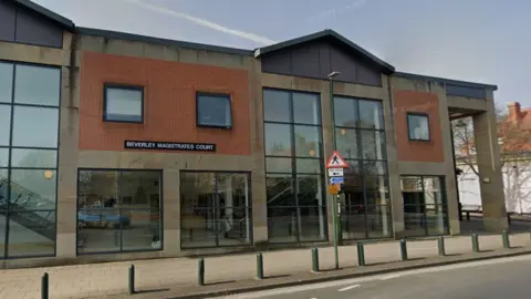 A Google Images screengrab of the exterior of Beverley Magistrates Court, it is a modern building with large glass windows. 