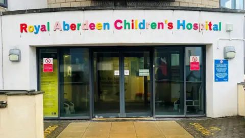 The entrance to Royal Aberdeen Children's Hospital, the name words are in bright letters.