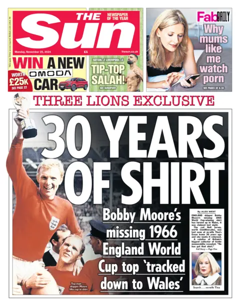  "30 years of shirt" and featuring a representation   of Bobby Moore lifting the World cupful  trophy successful  1966 aft  England's win. 