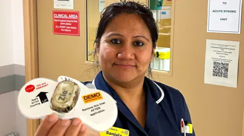 NHS Worcestershire Acute Hospitals Sanjula Dhungana holding one of the new Zio XT devices
