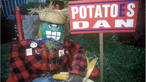 iStock An effigy of Dan Quayle and a sign with the words 'Potatoes Dan'