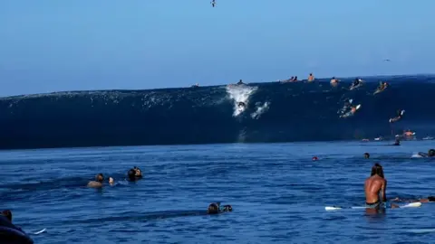 Tucker Wooding Tom Lowe at Teahupo'o