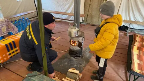 BBC Wood-burning stoves keep young and old warm in the town of Ladyzhyn