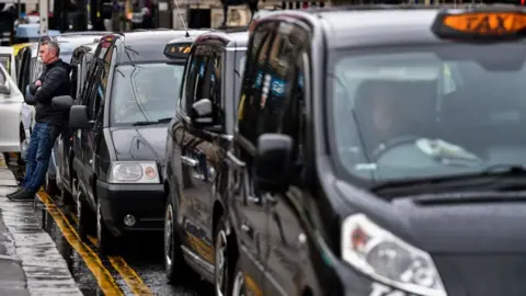 Getty Images Taxis in George Square