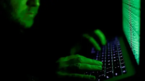 Reuters File image of a man using a computer keyboard