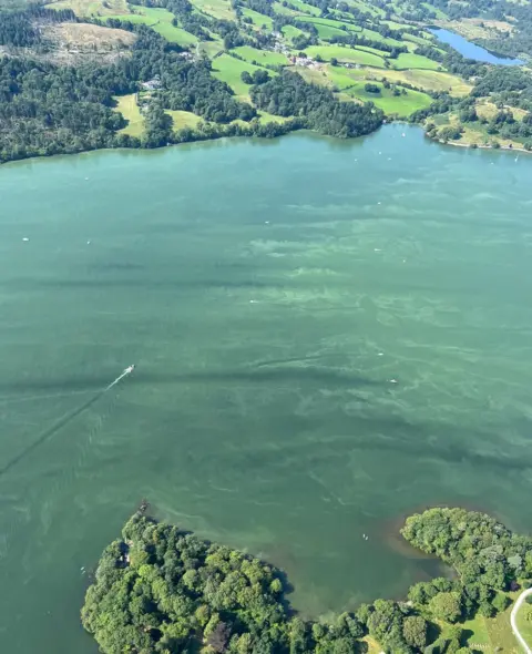 Lewis Harrison Aerial shot of Windermere showing the water with a blue-green colour