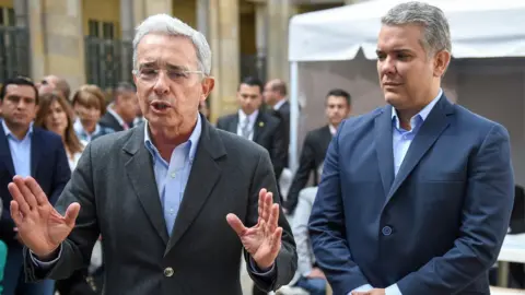 Getty Images Ivan Duque and Álvaro Uribe (left)