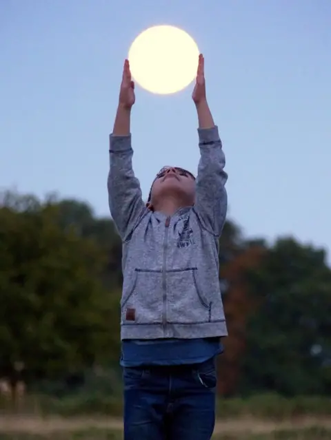 David Morgan Boy holding the Moon