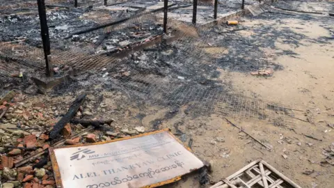 Burned Clinic in Al Lel Than Kyaw, with a sign showing the MSF logo